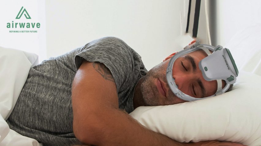 Man wearing continuous positive airway pressure device