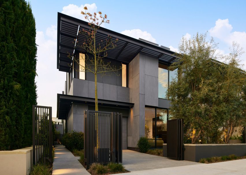 House exterior with dark cladding and flat roof