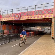 Photo of person cycling under a bridge in Battersea