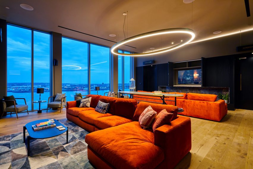 Living room with orange sofas