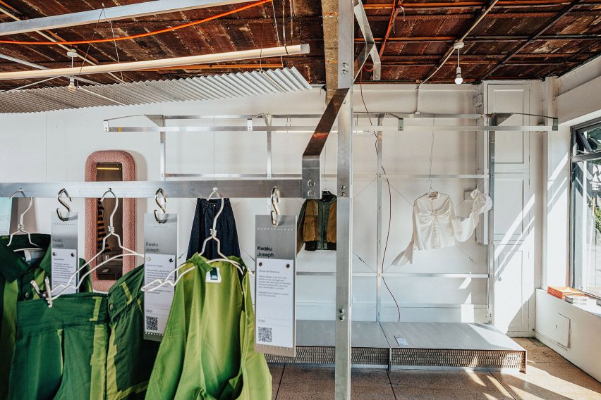 Clothes hanging inside Drop02 exhibition at London Design Festival 2023