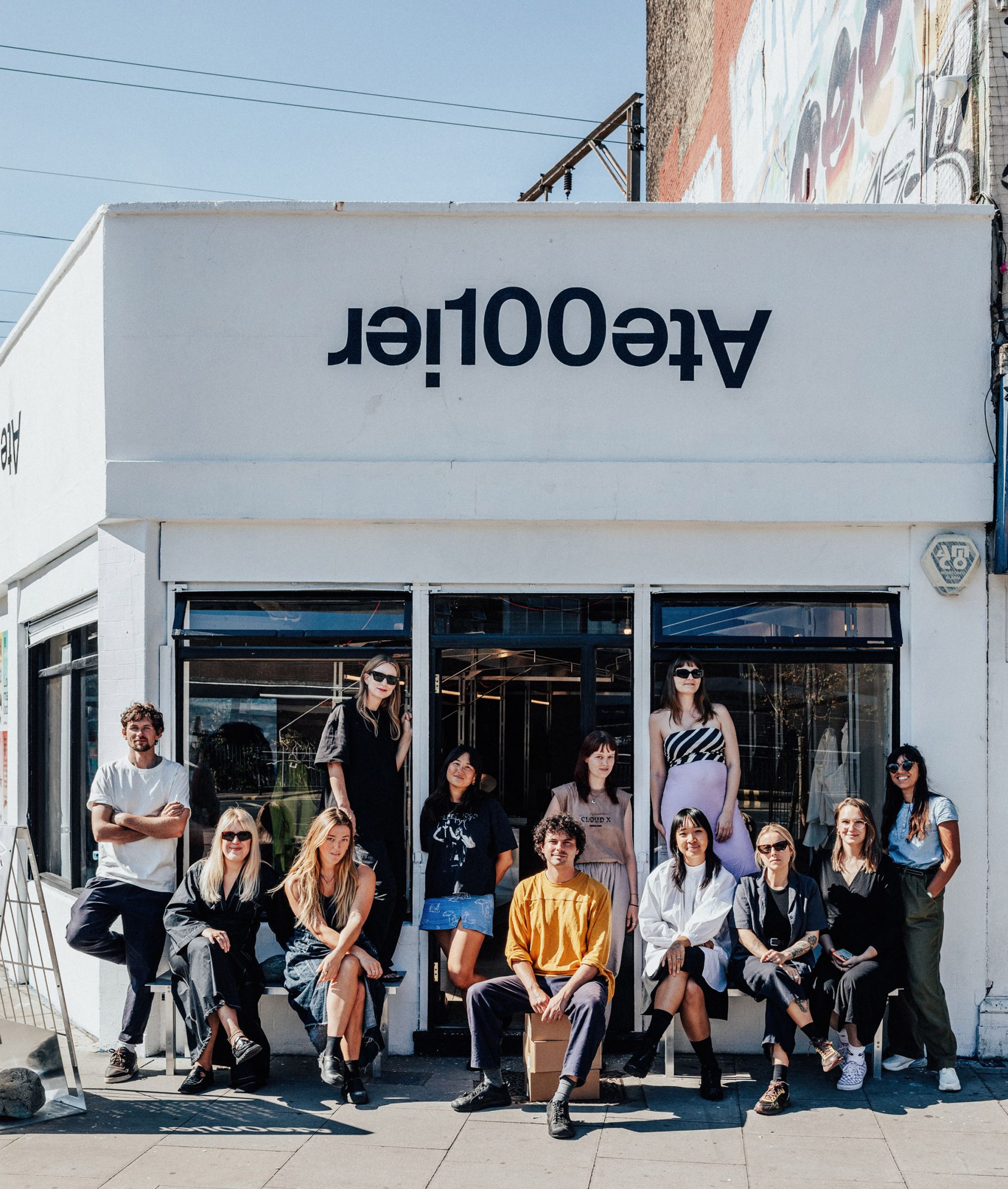 Atelier100's second cohort sitting outside the pop-up showroom in Dalston