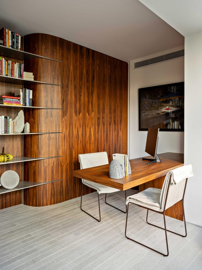 Home office with wood panelling and matching desk