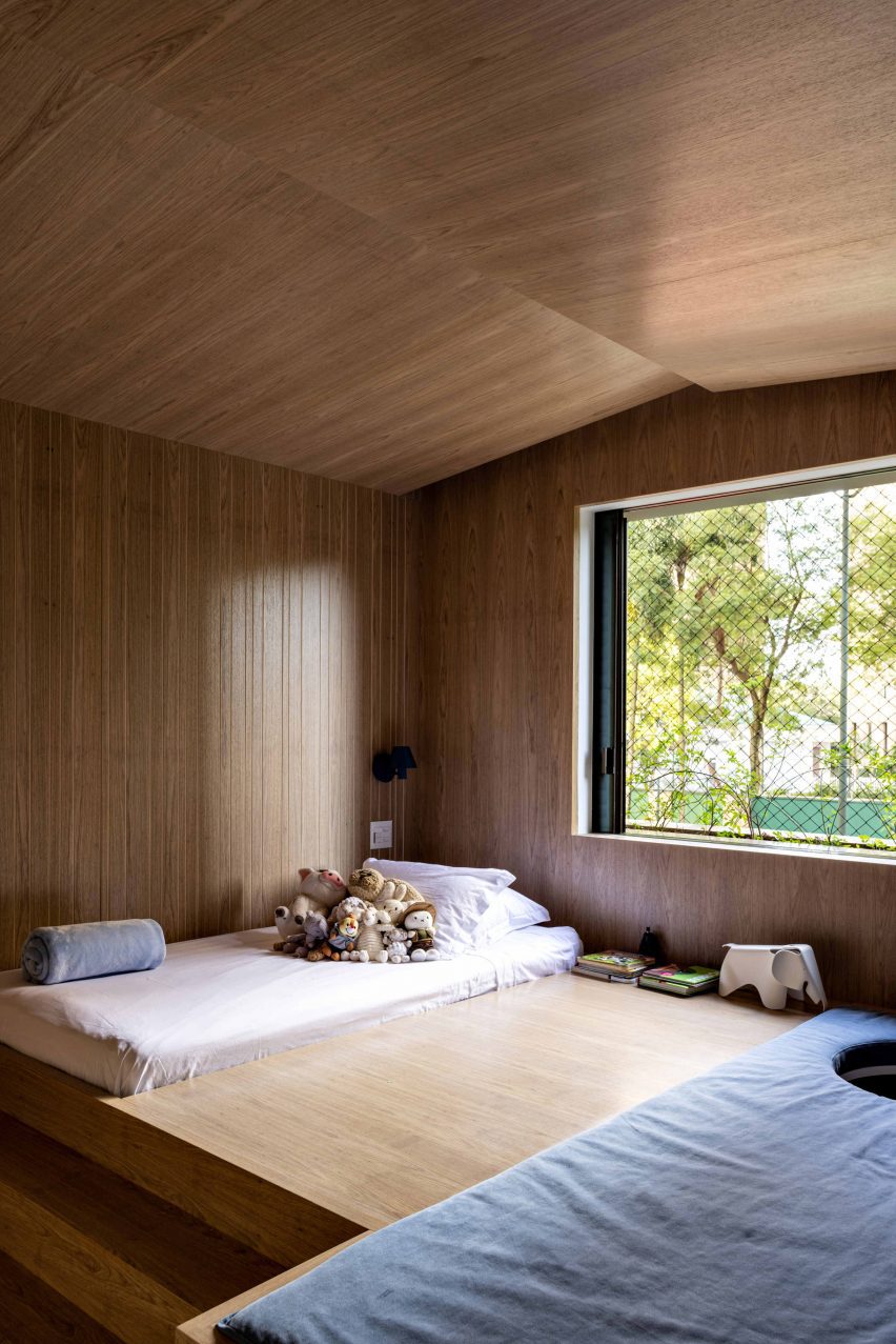Bedroom shaped like a house using wood panelling