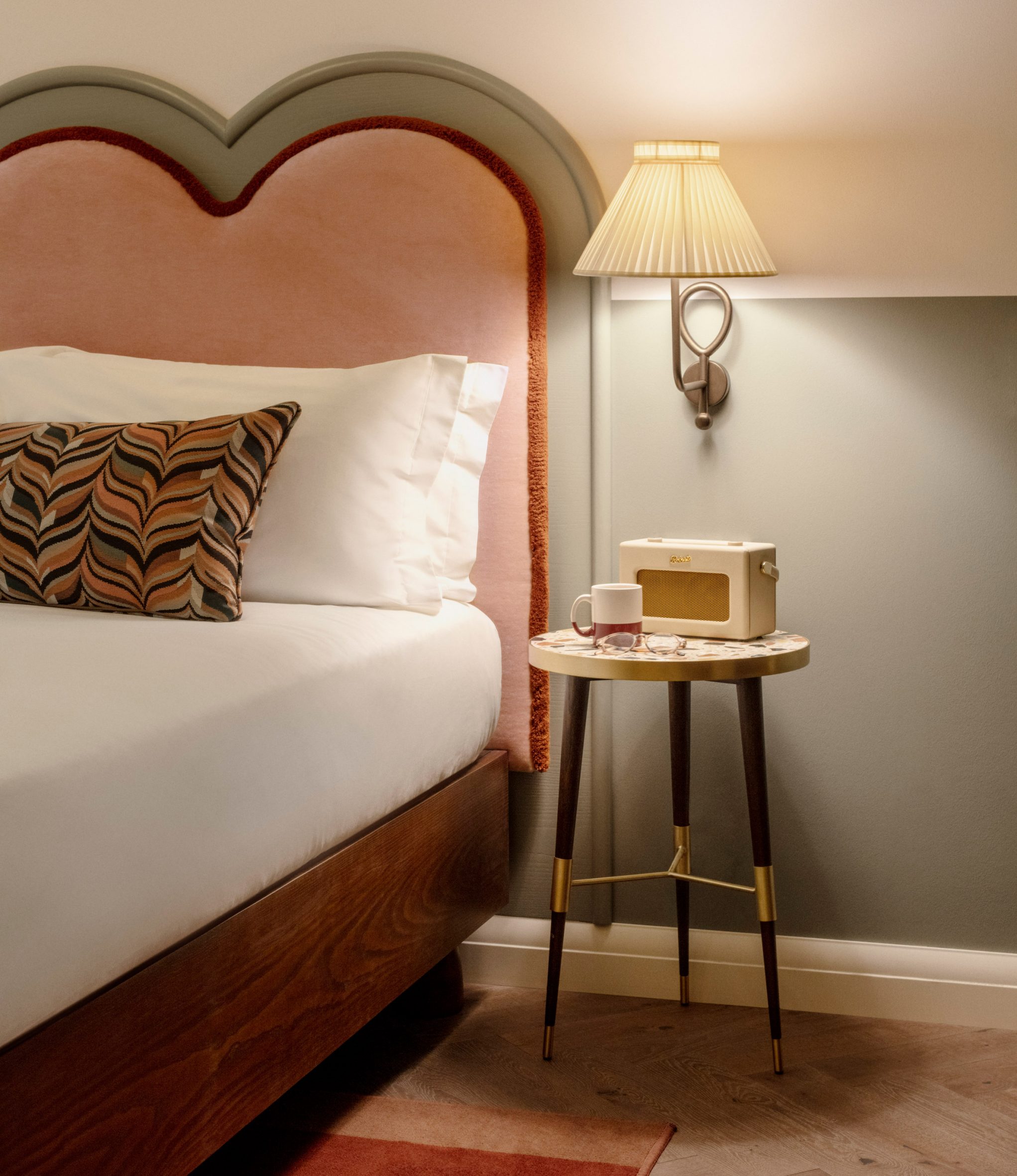 Close-up of hotel bed and nightstand