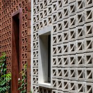 Red and grey perforated cement block facade