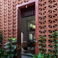 Doorway in a perforated red cement block building