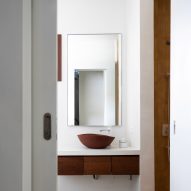 White bathroom interior with wood floating vanity unit