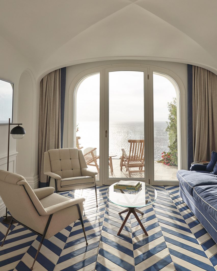 Guest rooms with vaulted ceiling, and blue and white tiled floors