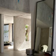 A big mirror at the entrance of a home.