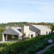 Coffey Architects draws on rural barns for coastal home in Dorset