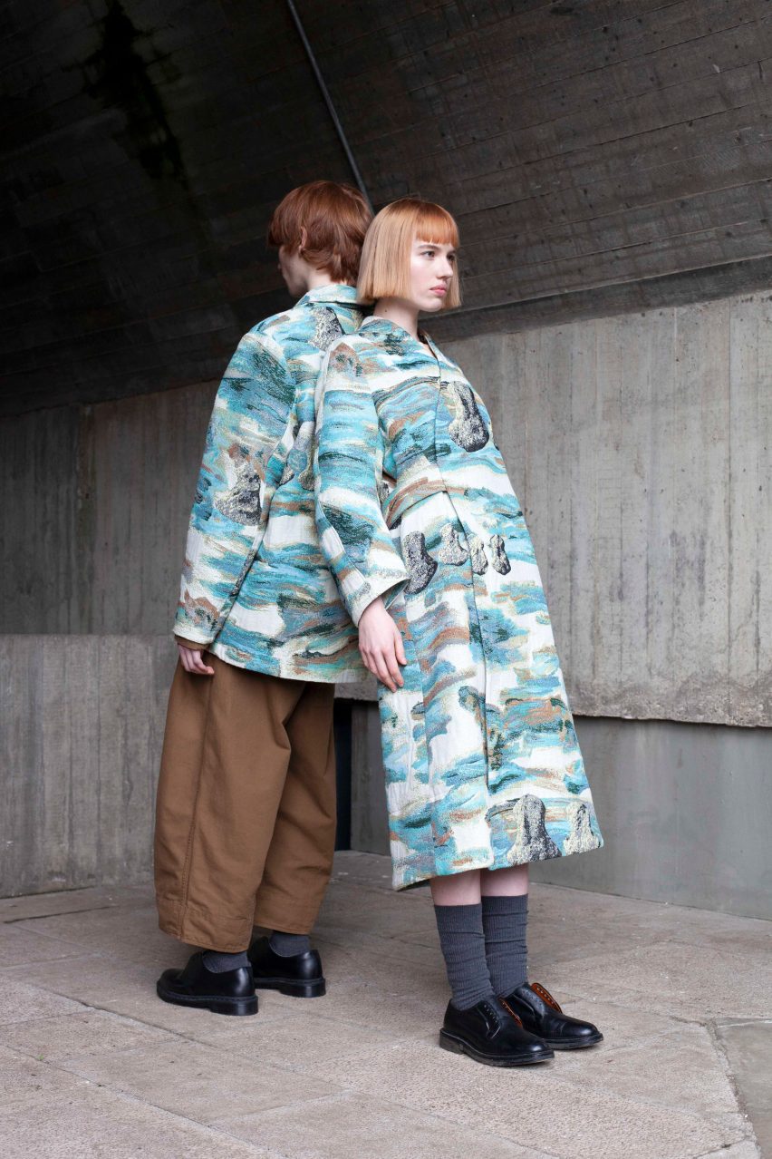 Two models wearing patterned blue and cream coats
