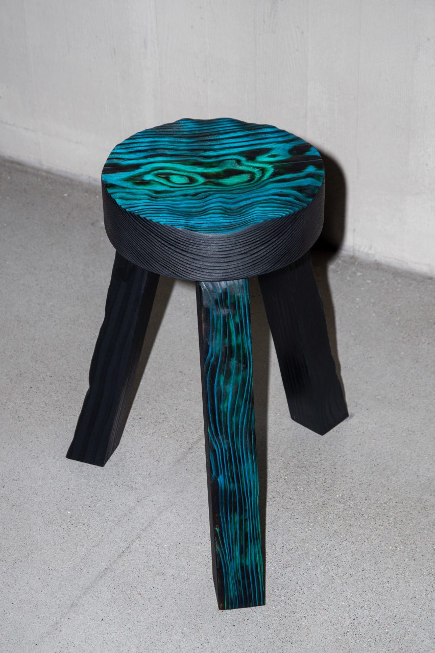 Lumpy three-legged green stool 