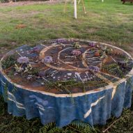 A circular table with plants and other memorabilia