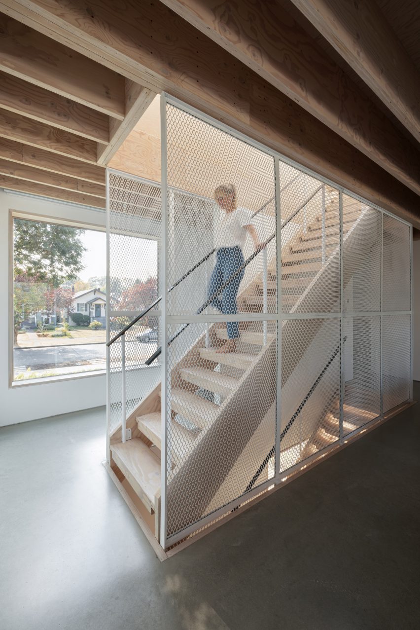 Metal mesh staircase within East Van Residence