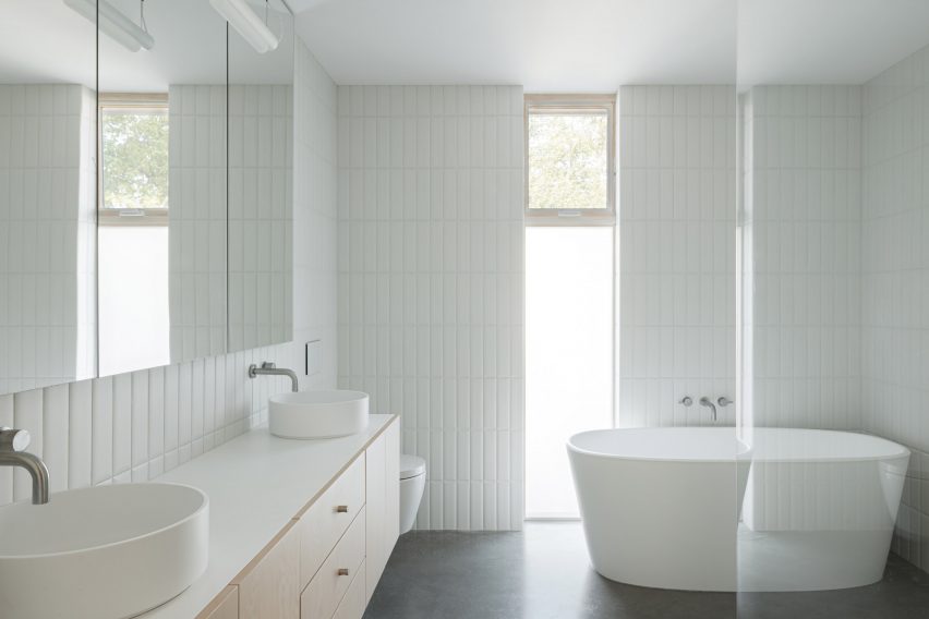 White-walled bathroom within home by SMStudio