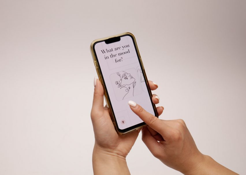 Photo of a smartphone screen with a person's hands scrolling over it. The text on the screen reads "What are you in the mood for?" along with a minimal, black line illustration of an upturned face composed of tendrils of plants