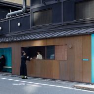 Seating and serving hatch in copper-clad kiosk in Kyoto by G Architects Studio
