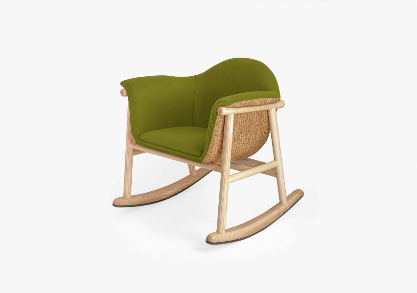 Green-upholstered wooden rocking chair
