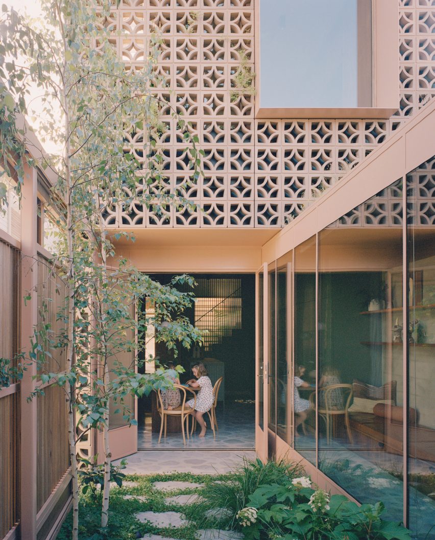 Pale pink exterior of Garden Tower House by Studio Bright