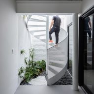 White spiral staircase at Casa Yuji by Goiva