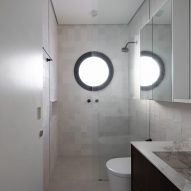 White bathroom with a circular window