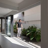 Sliding glass doors at Casa Yuji in Sao Paulo by Goiva