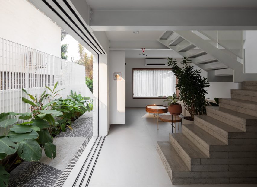 Living space with a concrete block staircase and outdoor area