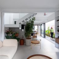 Open-plan living space at Casa Yuji in Sao Paulo by Goiva