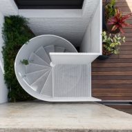 White spiral staircase and wood decking