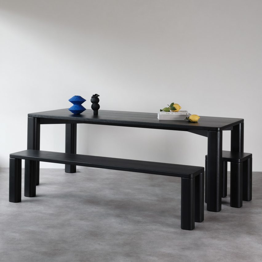 Black wooden dining table, benches and stools