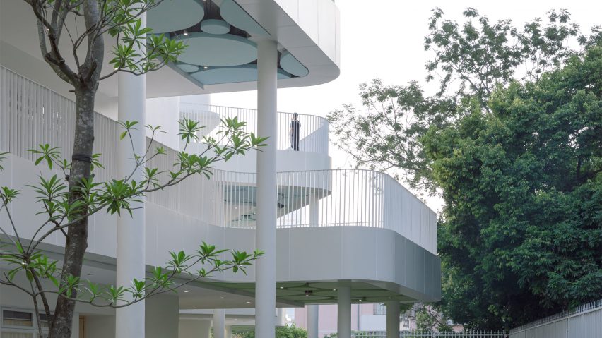 White curving classroom balconies at Kindergarten of Museum Forest by Atelier Apeiron