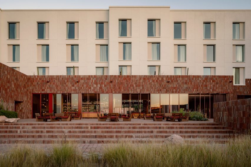 A hotel with a long stone facade