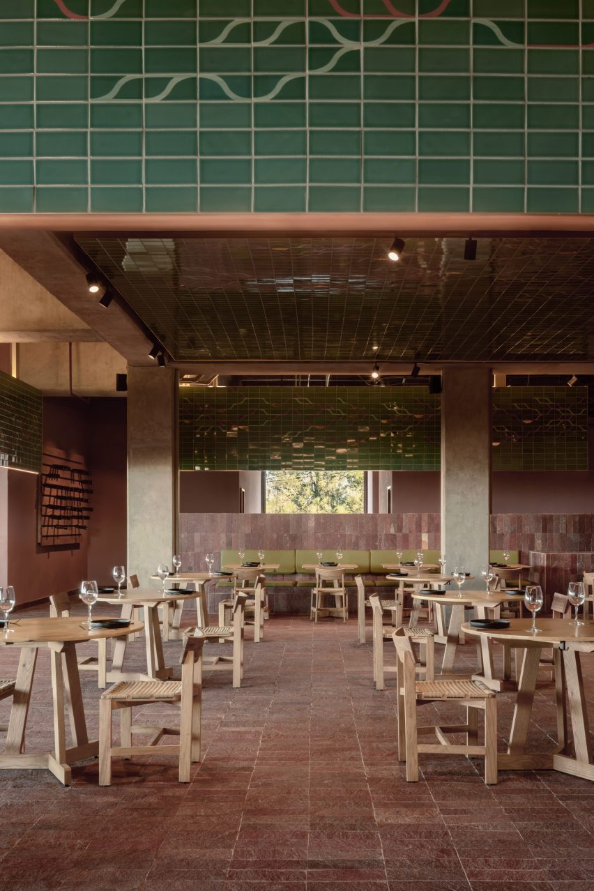 Hotel lobby with wooden chairs and green tiled canopy