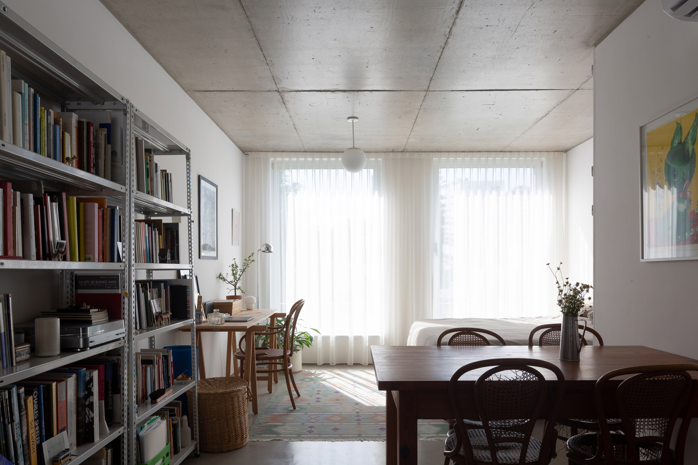 Concrete living room interior at Virrey Aviles Street apartments by Juan Campanini and Josefina Sposito