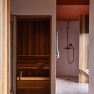 Pink and terracotta-toned walk-in shower room