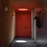 Corridor with a red door and oculus