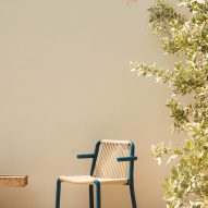 Photograph of blue and beige chair by pool