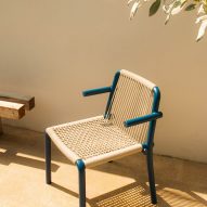 Photograph of blue and beige chair by pool