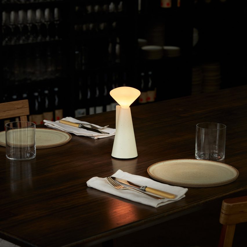 Lamp on table in dimly-lit restaurant