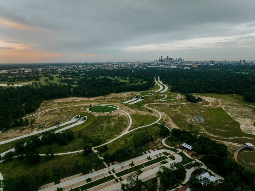 A park in houston with curving pathways and a two landbridges