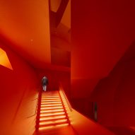 Red stairway at the Space Crystals museum by Open Architecture
