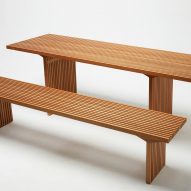 Photograph of wooden bench and table on white backdrop