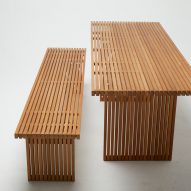 Photograph of wooden bench and table on white backdrop