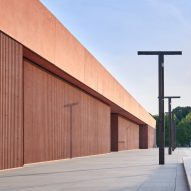 Pink concrete forms "geometric and disciplined" wing of Polish Army Museum