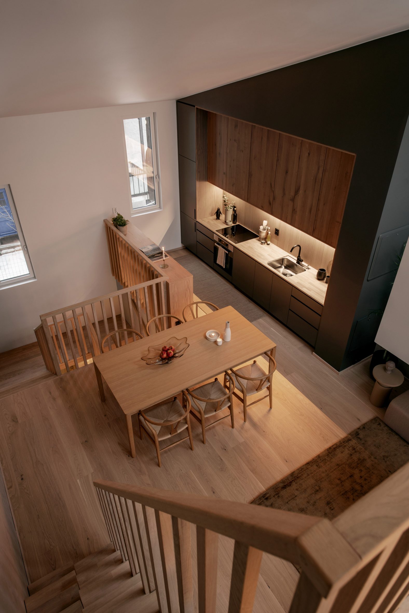 Interior photo of a kitchen and dining room at Sagene Wood Trade by Reiulf Ramstad Arkitekter 