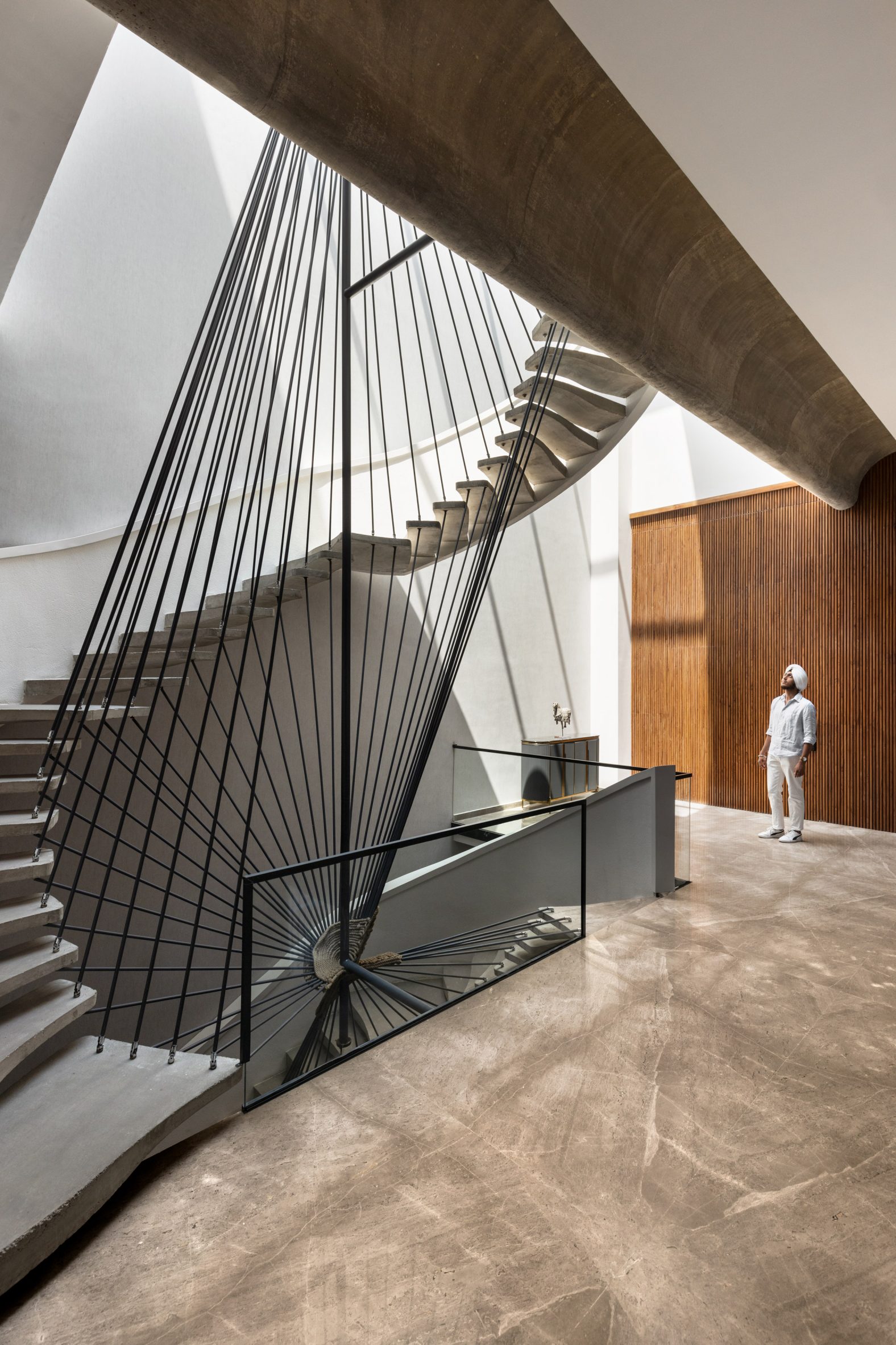 Concrete staircase in Ribbon House by Studio Ardete
