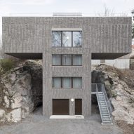 Spridd slots T-shaped house into rocky hillside in Stockholm