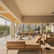 Living room at Casa Madre by Taller David Dana with floor to ceiling windows