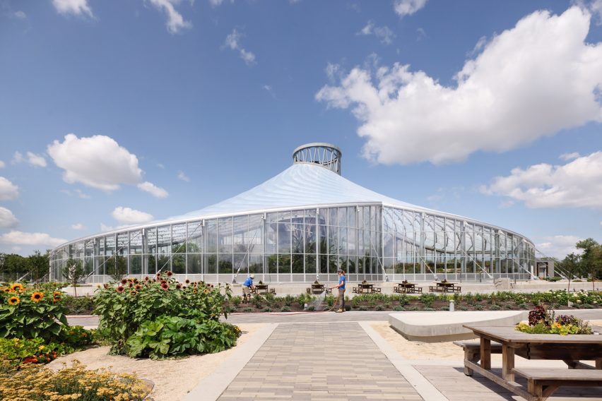 A greenhouse building with a tent-like roof